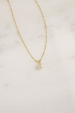 Gold pearl pendant necklace from Sami Jewels featuring a classic round pearl on a delicate chain.
