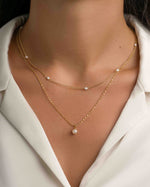 Gold layered pearl pendant necklace by Sami Jewels featuring a elegant pearl drop on a delicate chain.