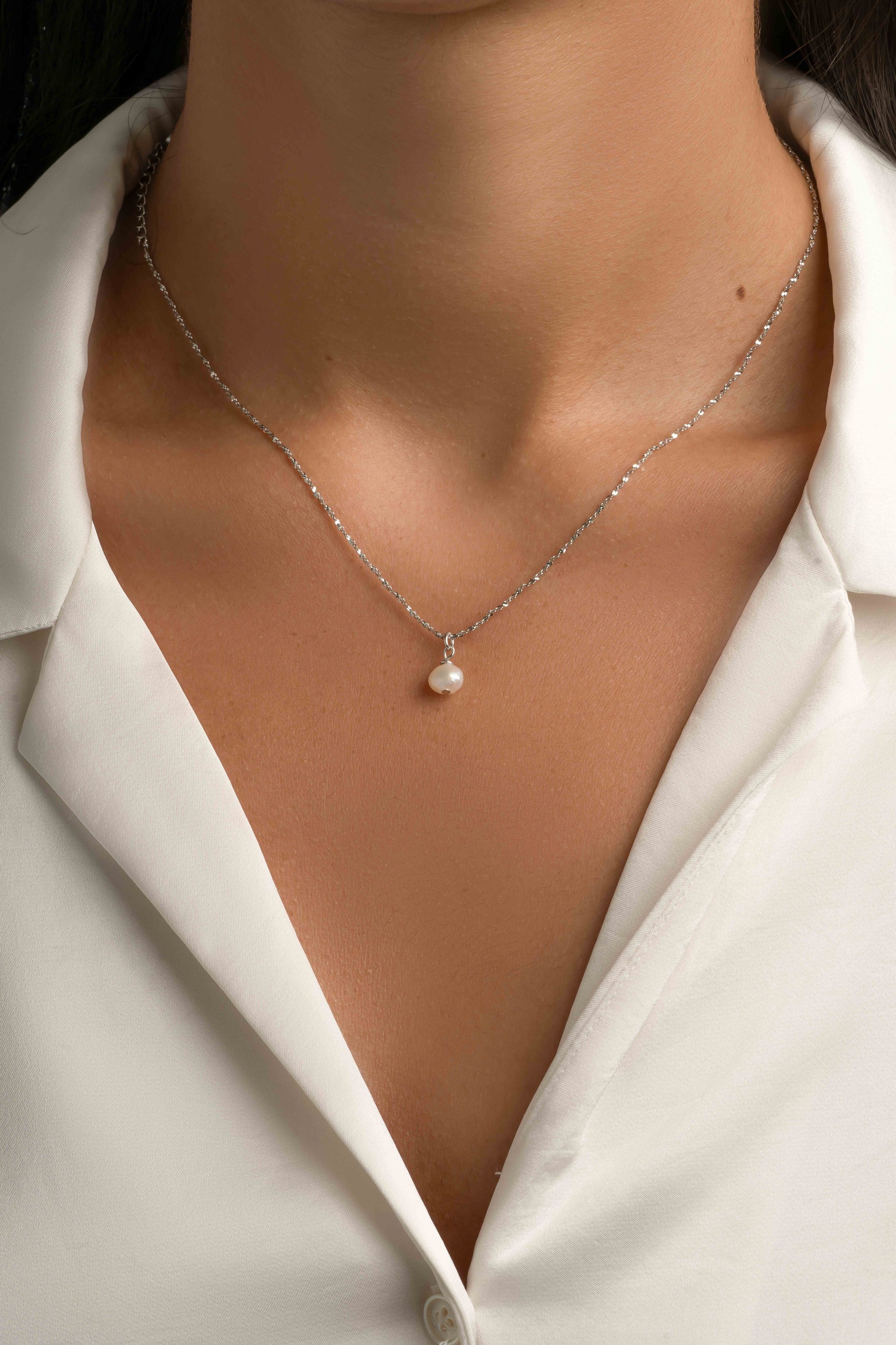 Sterling silver Pearl Pendant Necklace by Sami Jewels featuring a single elegant pearl on a delicate chain.