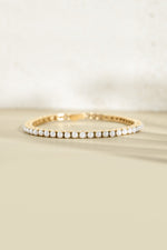 Sami Jewels SS Pearl Tennis Bracelet with gold stainless steel links and freshwater pearls, front view, waterproof design.