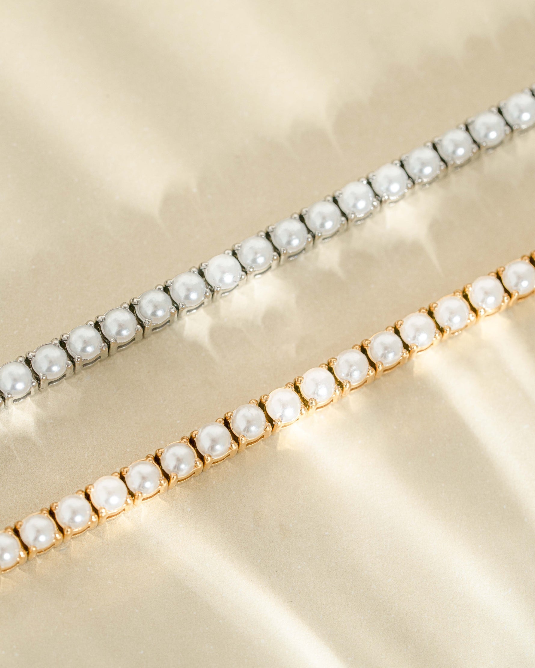 Sami Jewels SS Pearl Tennis Bracelet with silver and gold stainless steel, waterproof, featuring elegant pearl beads.
