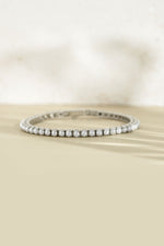 Sami Jewels SS Pearl Tennis Bracelet featuring silver stainless steel and waterproof design, front view of elegant pearl beads.