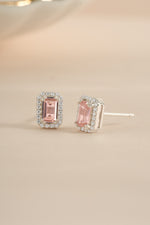 Pink baguette stud earrings by Sami Jewels, sterling silver earrings with an angled view showcasing elegant design.