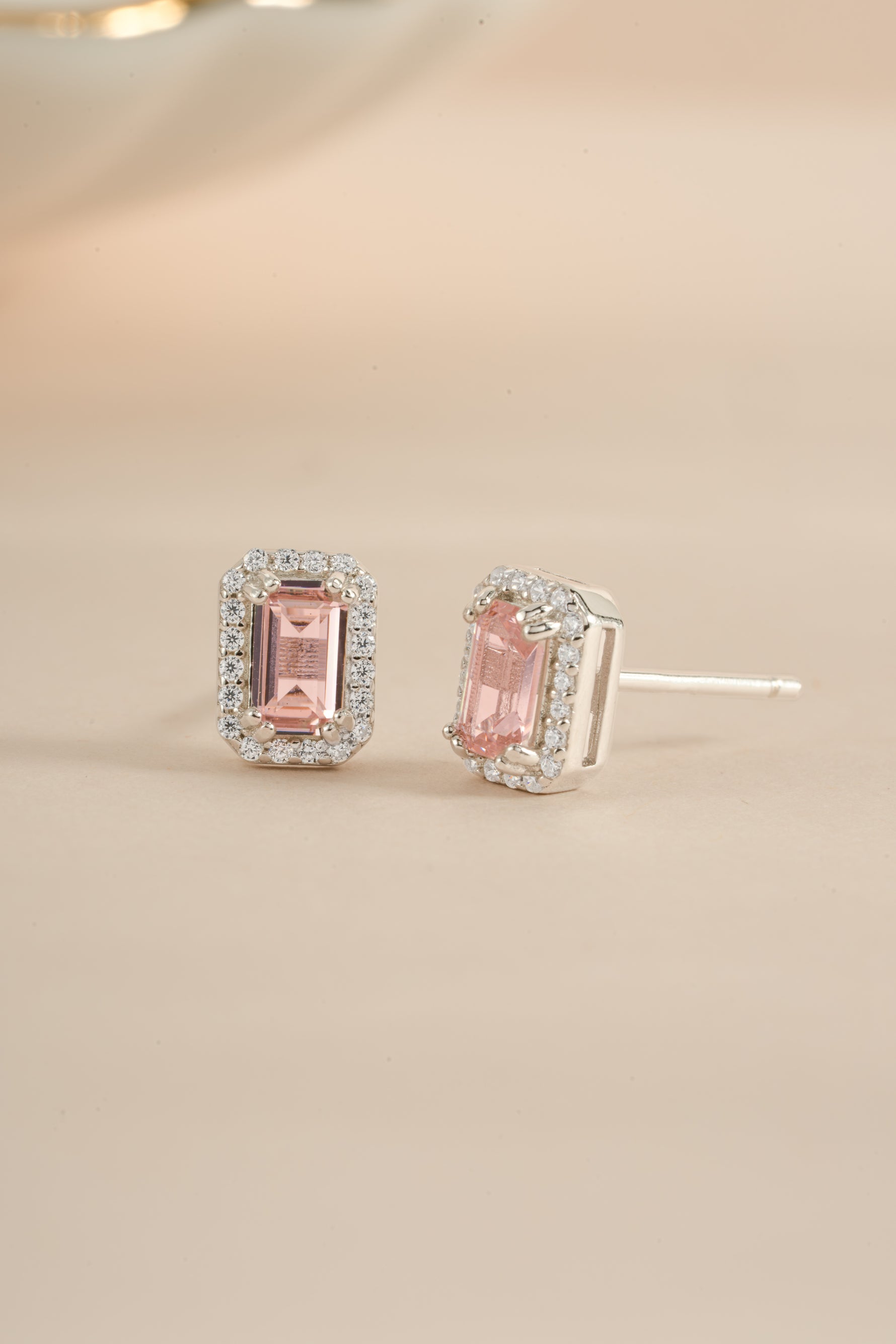 Pink baguette stud earrings by Sami Jewels, sterling silver earrings with an angled view showcasing elegant design.