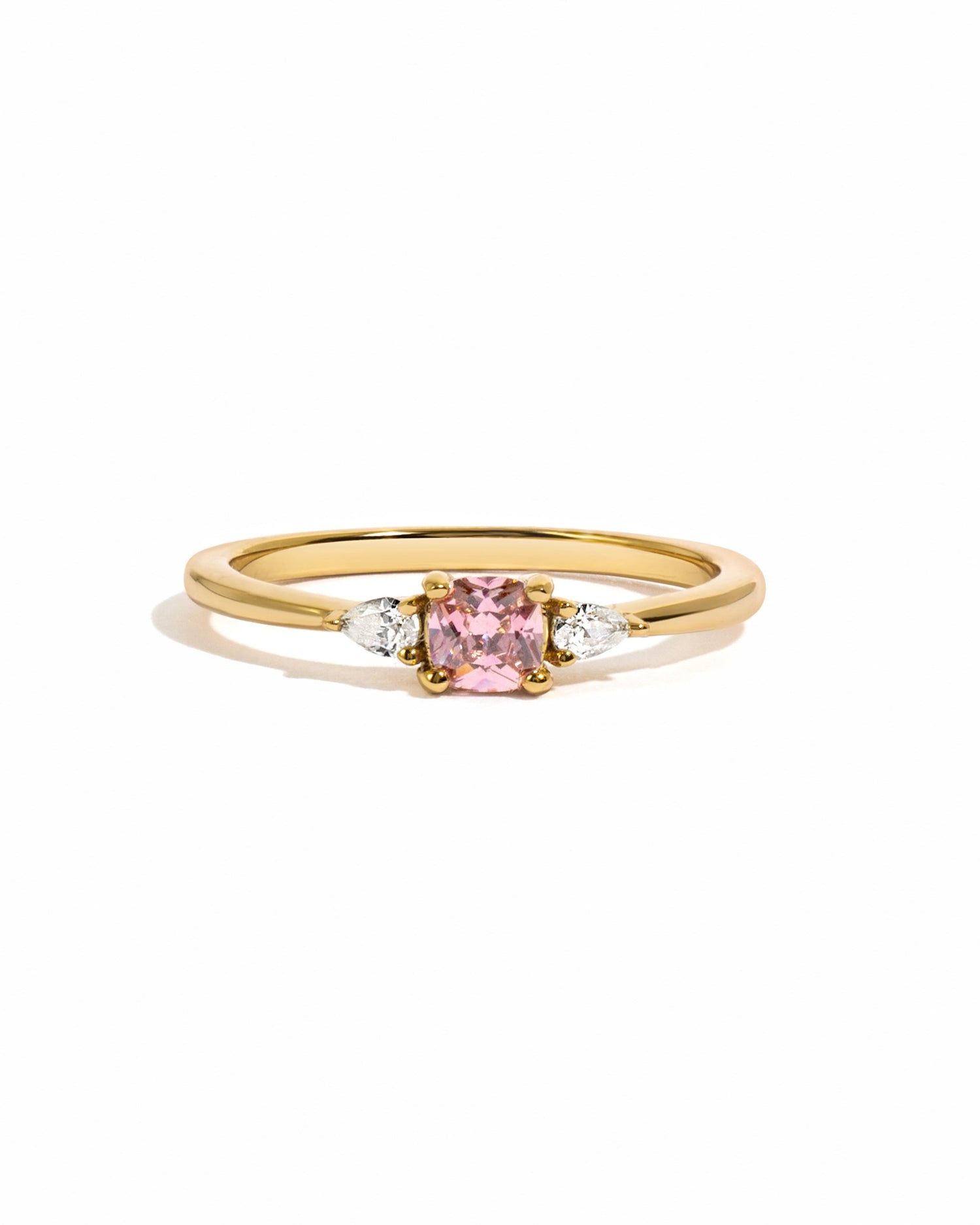 Gold pink cushion ring from Sami Jewels, featuring a vibrant pink gemstone set on a delicate band against a white background.