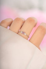 Pink cushion ring by Sami Jewels, sterling silver jewelry, displayed on a model's finger showing its elegant design.
