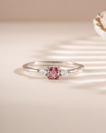 Pink cushion ring by Sami Jewels featuring a sterling silver band and a pink cushion-shaped gemstone.