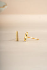 Gold plain bar stud earrings by Sami Jewels, featuring sleek, minimalist design with straight bar front view.