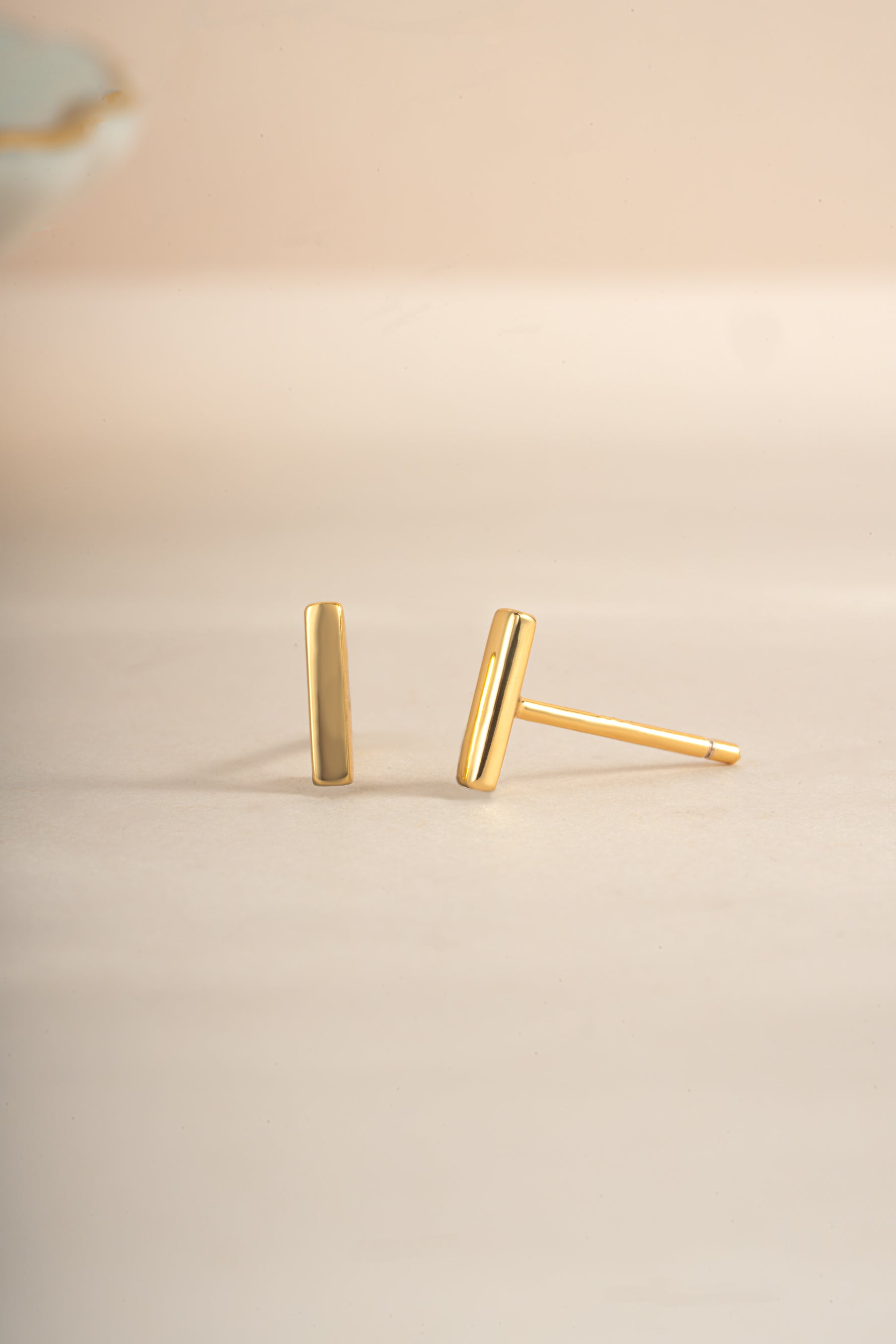 Gold plain bar stud earrings by Sami Jewels, featuring sleek, minimalist design with straight bar front view.