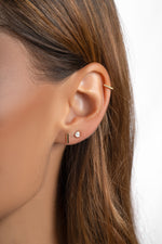 Gold plain bar stud earrings from Sami Jewels displayed on a model, showcasing simple and elegant jewelry design.
