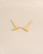 Gold plain bar stud earrings by Sami Jewels, top view showing minimalist design and smooth finish.