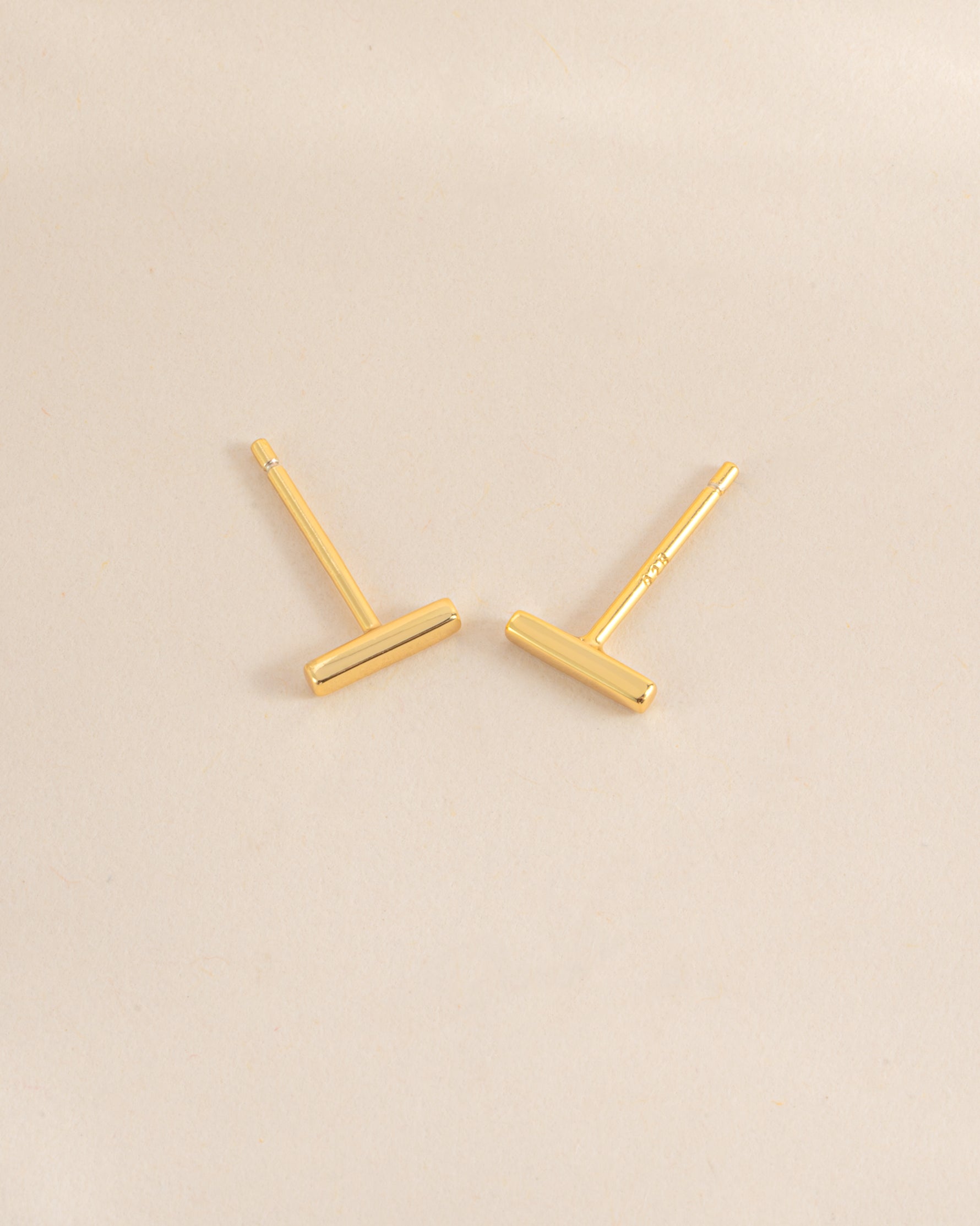 Gold plain bar stud earrings by Sami Jewels, top view showing minimalist design and smooth finish.