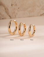 plain huggie hoop earring in various sizes featuring a 9mm plain huggie hoop, 10mm plain huggie, and a 12mm plain huggie