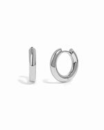 plain huggie hoop earring in sterling silver on a white background