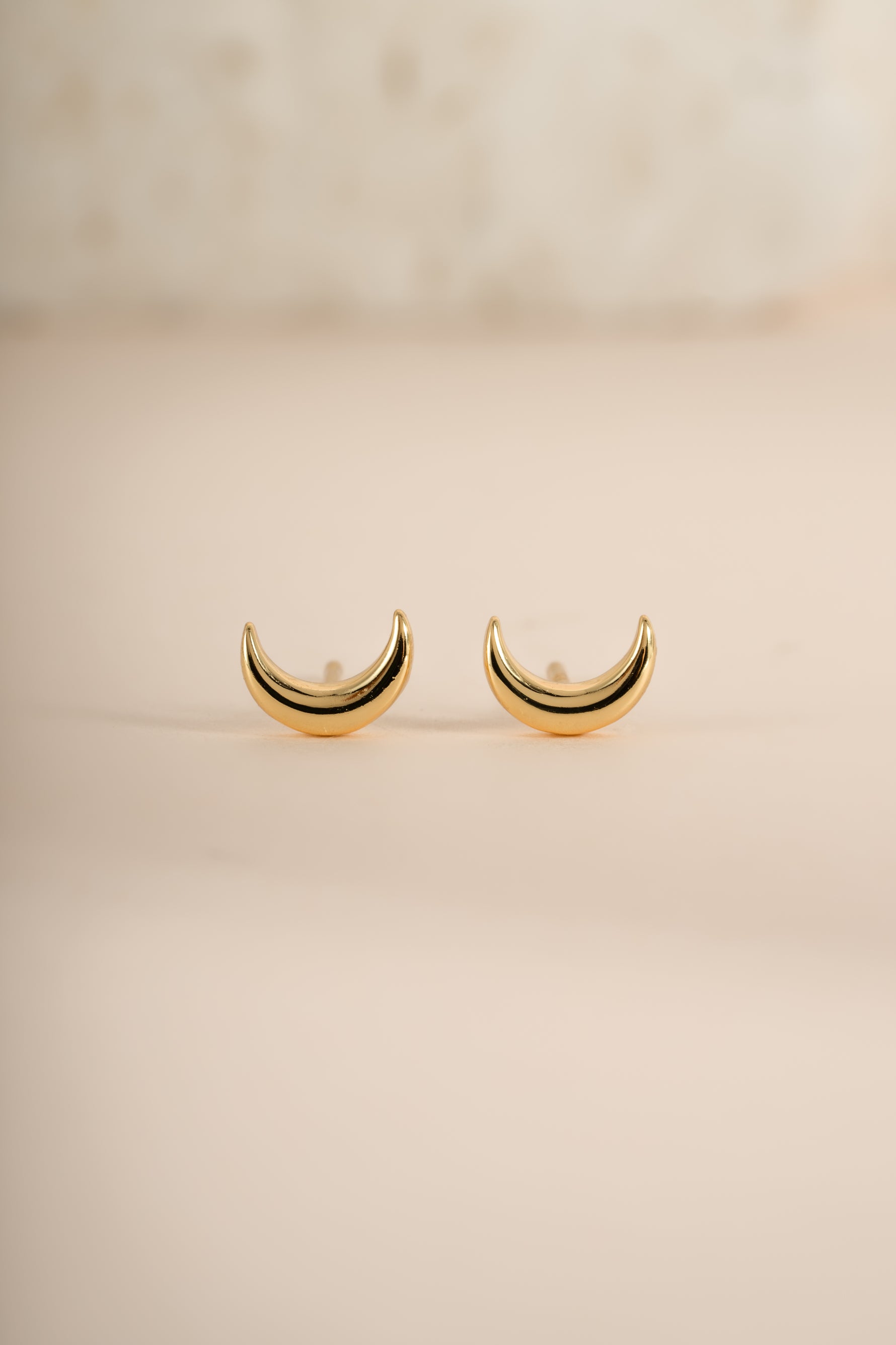 Gold plain moon stud earrings by Sami Jewels featuring simple, round moon-shaped design in a minimalist style.