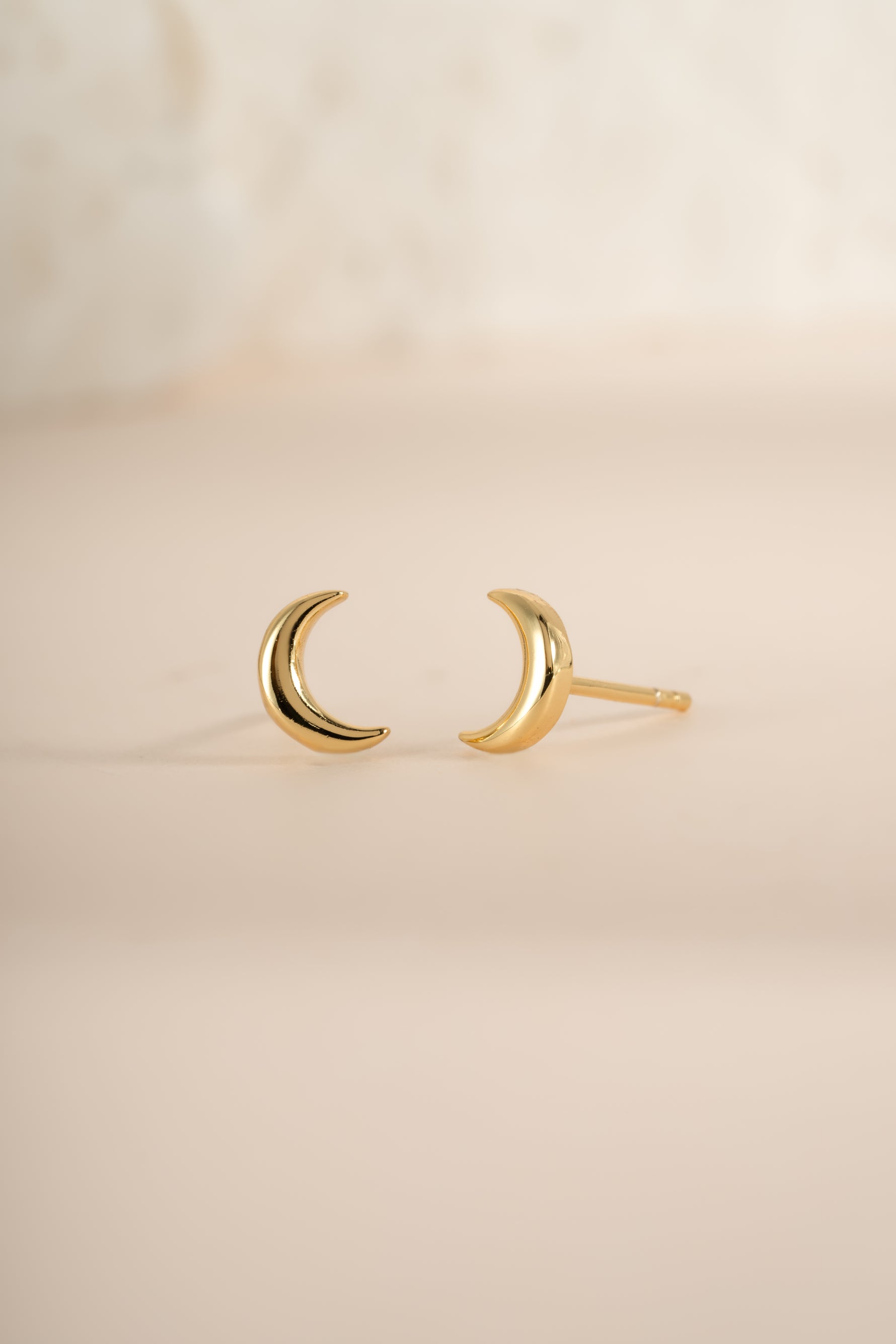 Gold plain moon stud earrings from Sami Jewels featuring simple, round moon-shaped design with a smooth finish.