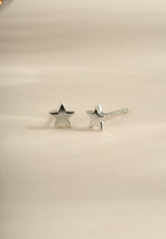 Sterling silver plain star stud earrings by Sami Jewels, small and minimalist star-shaped jewelry for pierced ears.