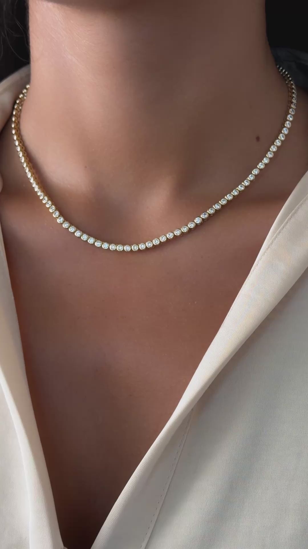 round bezel tennis necklace in gold on model