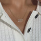 Video of model wearing dainty pave 222 angel number necklace with white sweater