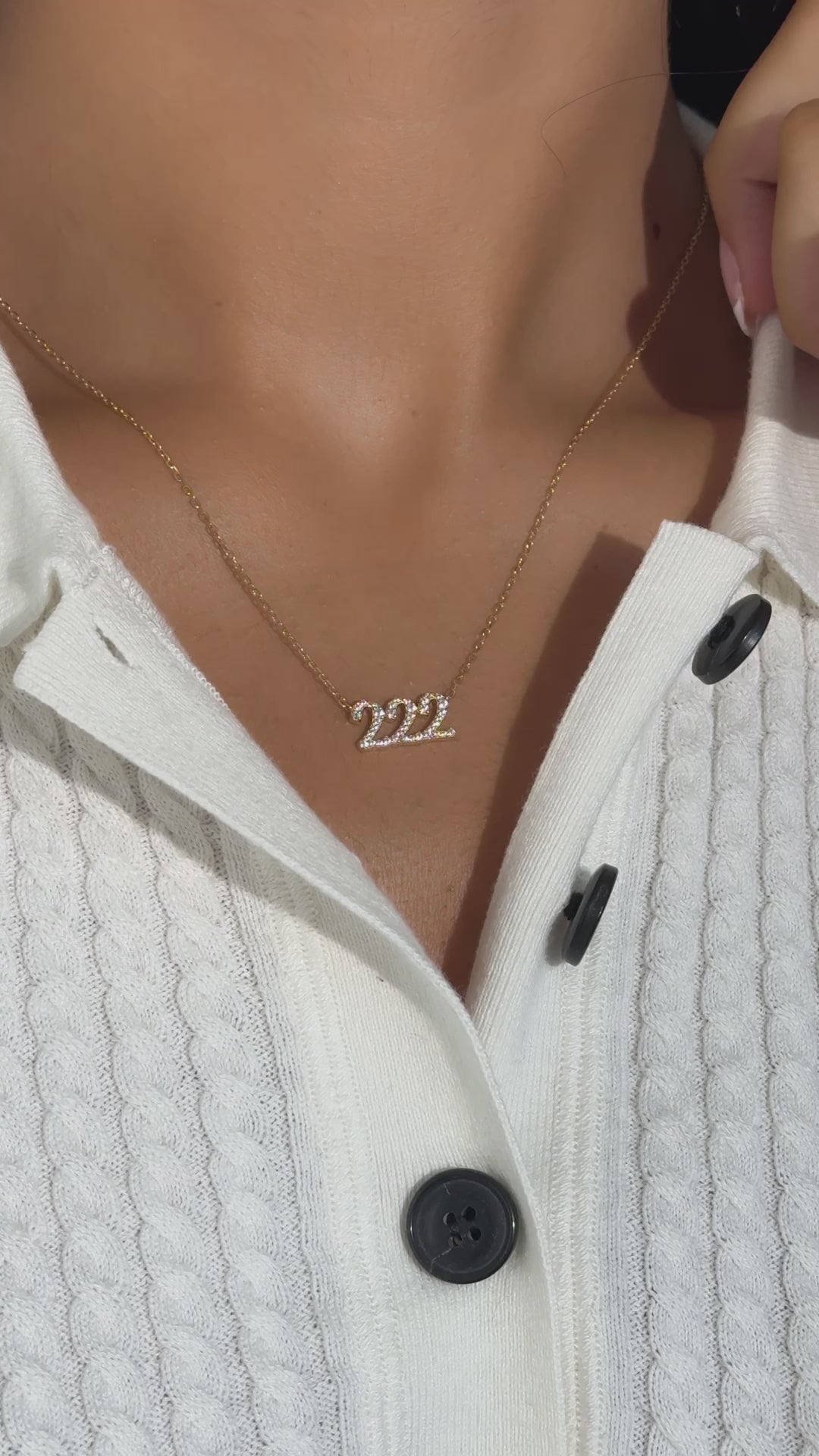 Video of model wearing dainty pave 222 angel number necklace with white sweater