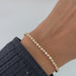 Video of model wearing gold tennis bracelet from Sami Jewels