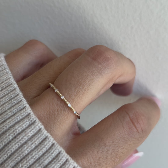 Thin gold ring on model