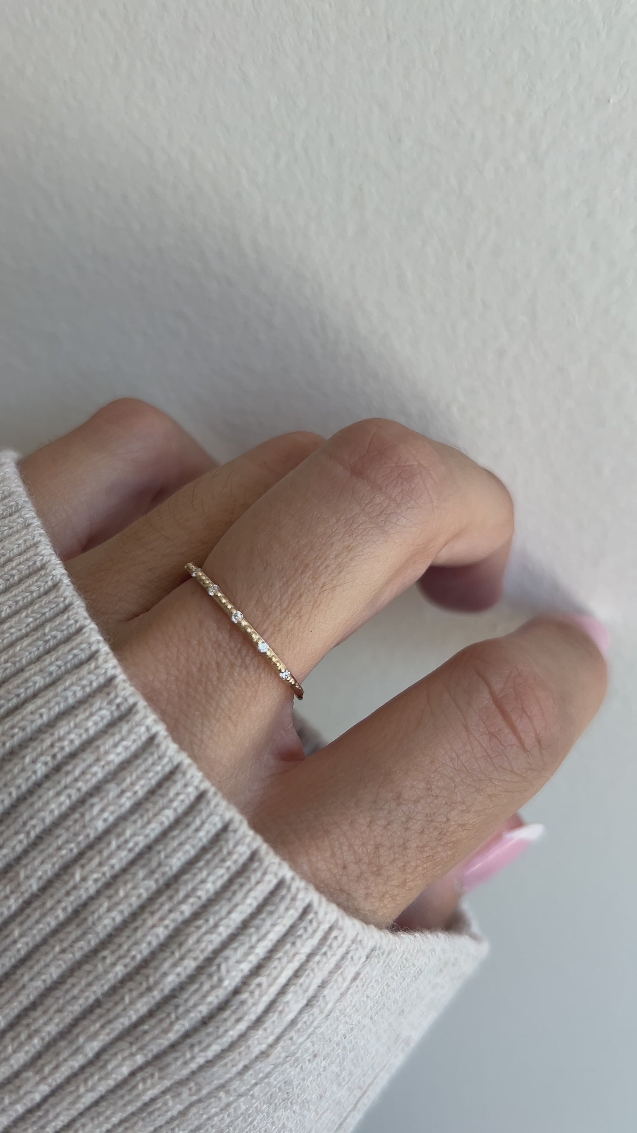 Thin gold ring on model