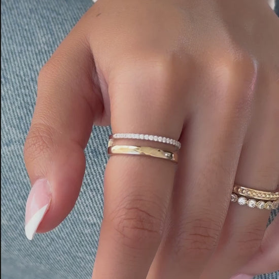 Video of model wearing plain and diamond line ring in gold with other dainty gold rings from Sami Jewels