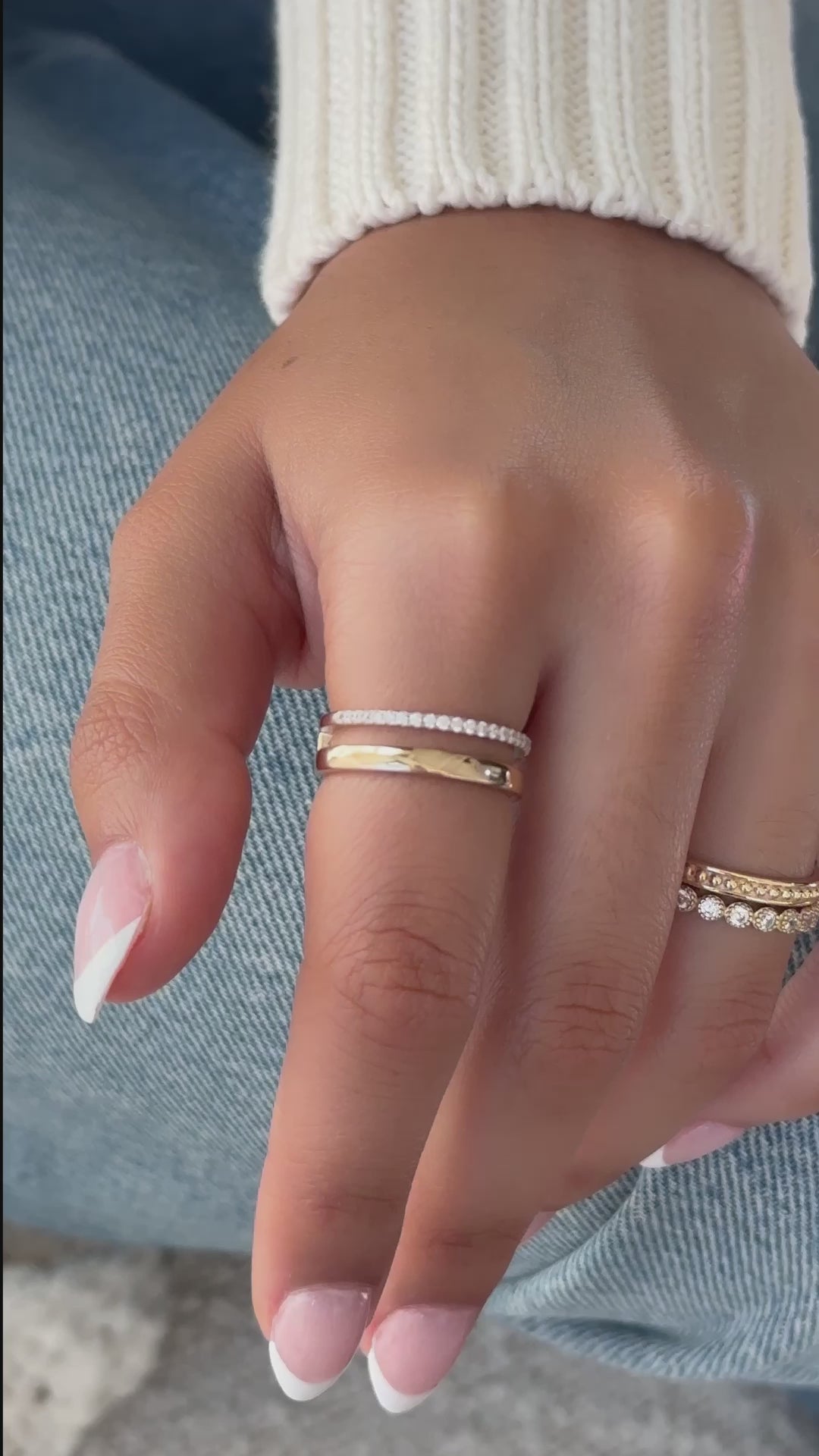 Video of model wearing plain and diamond line ring in gold with other dainty gold rings from Sami Jewels