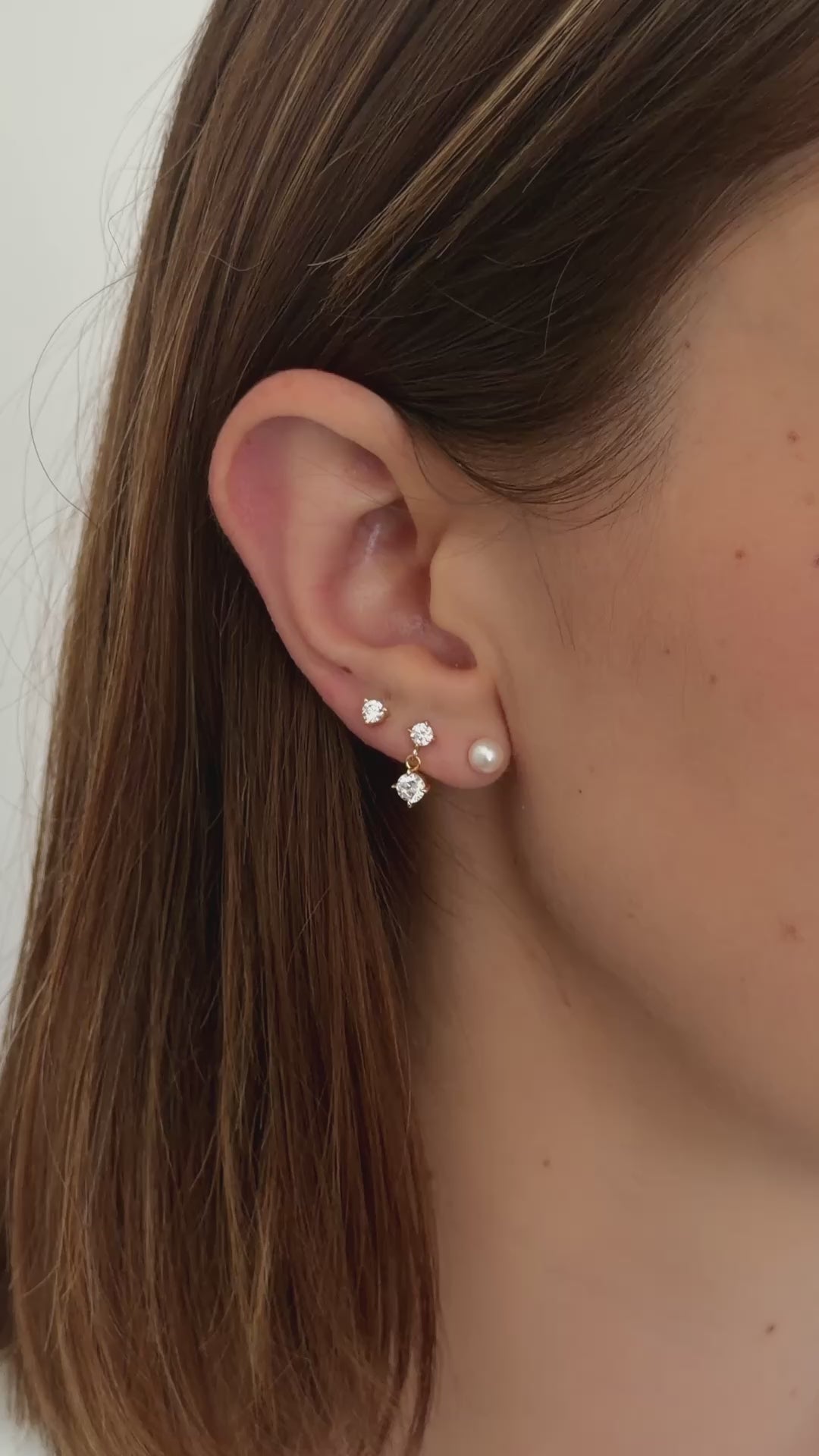 freshwater pearl stud earrings in gold on model video