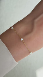 opal beaded bracelet in gold on model