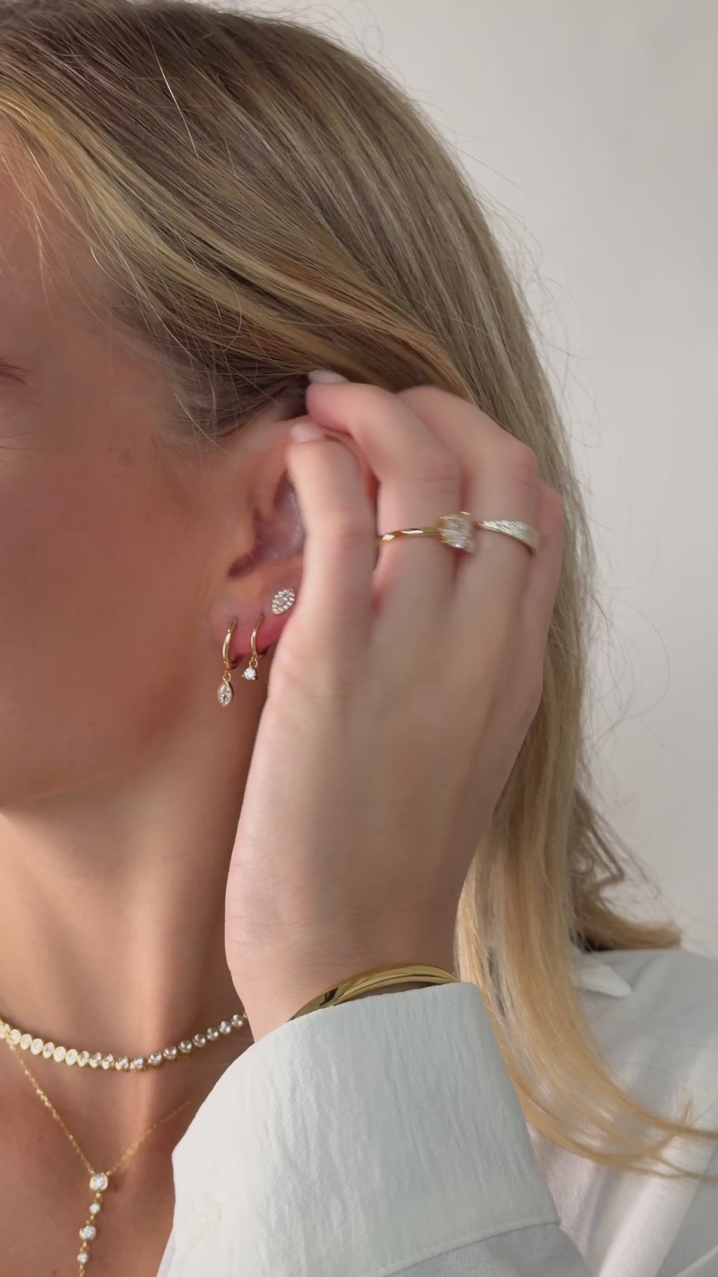 marquise bezel drop huggie earrings in gold on model video