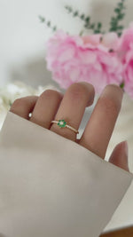 emerald flower ring in gold on model video 