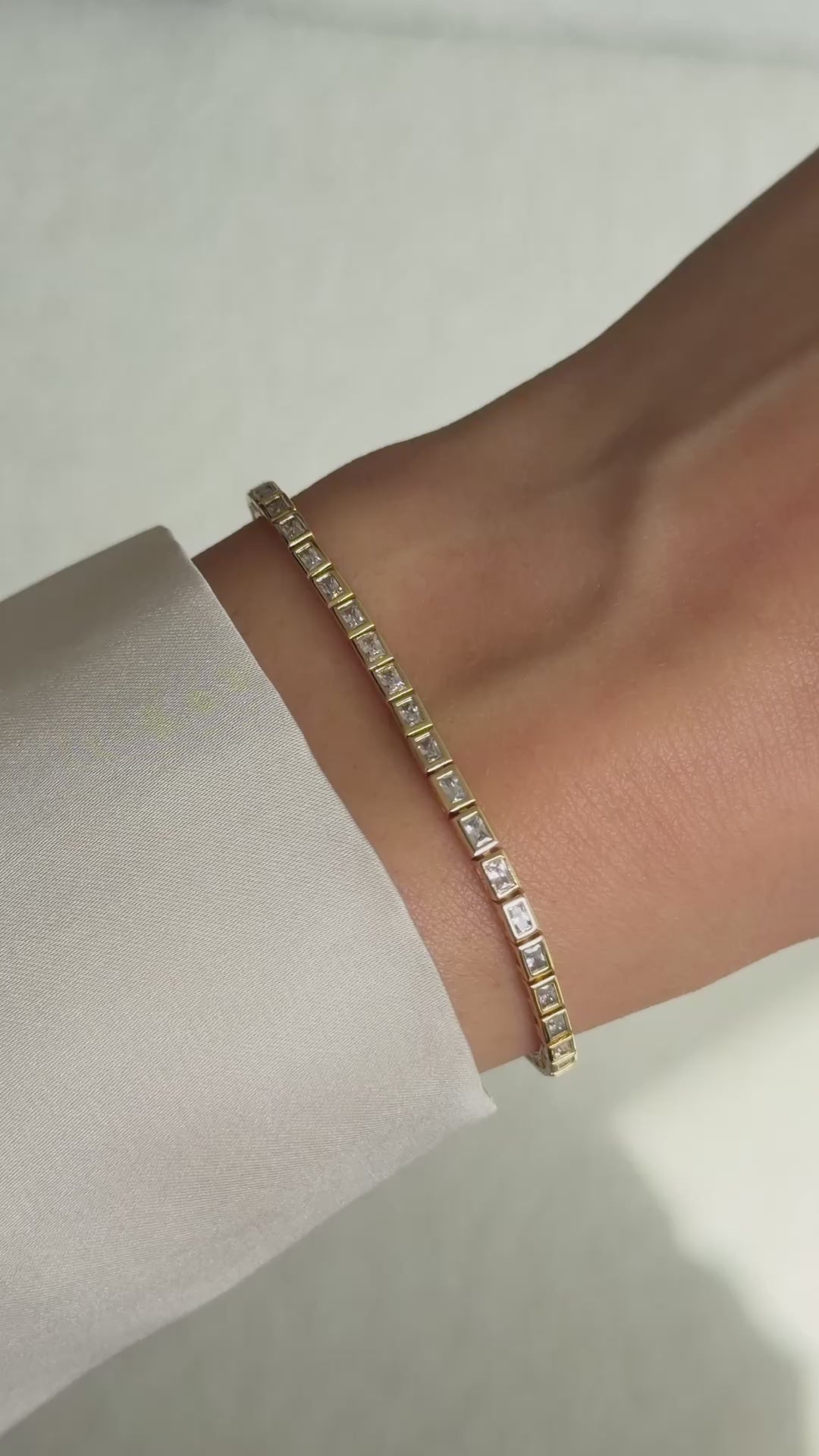 bezeled baguette tennis bracelet in gold on model