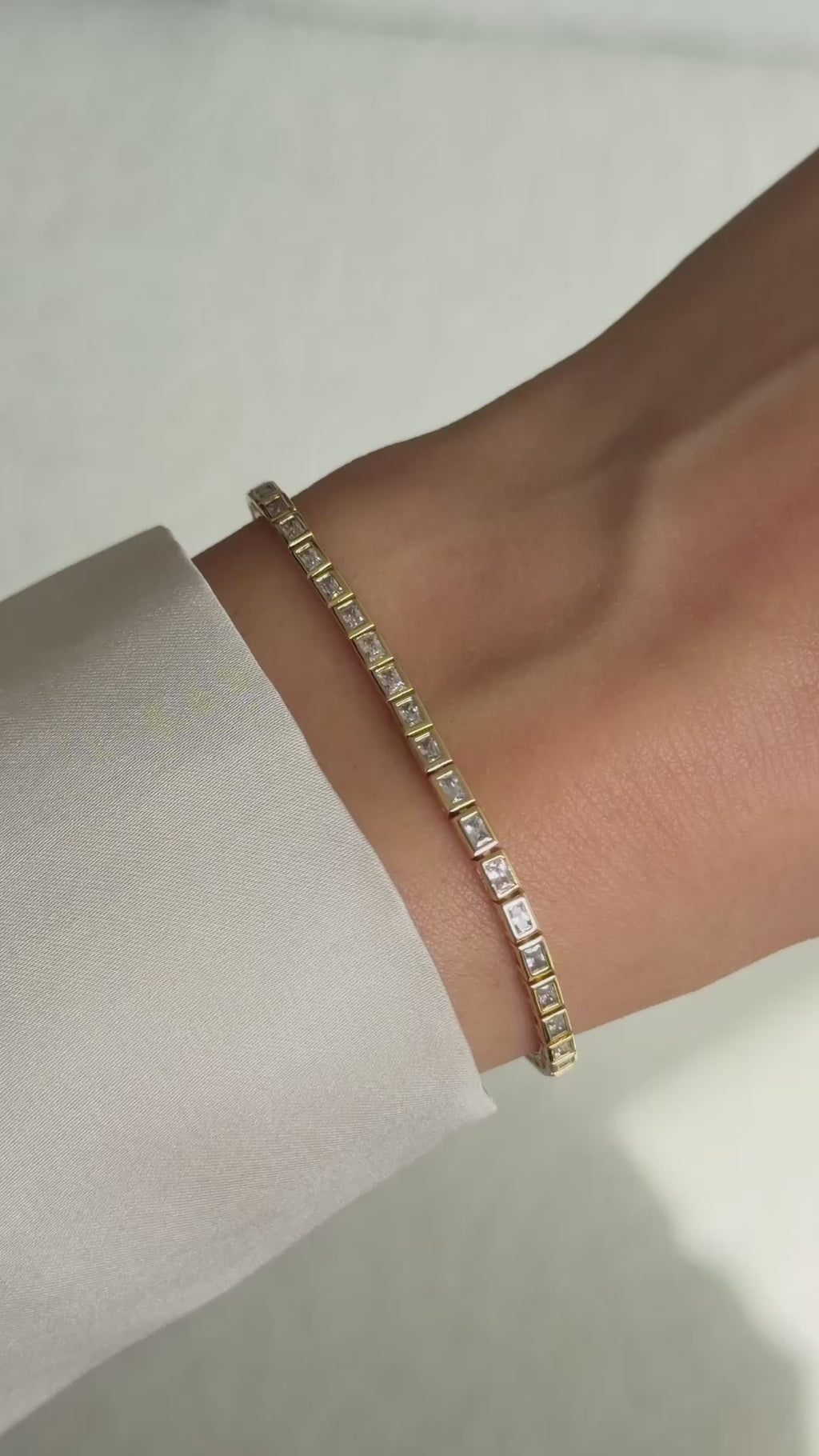 bezeled baguette tennis bracelet in gold on model