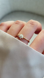 opal flower ring in gold on model 