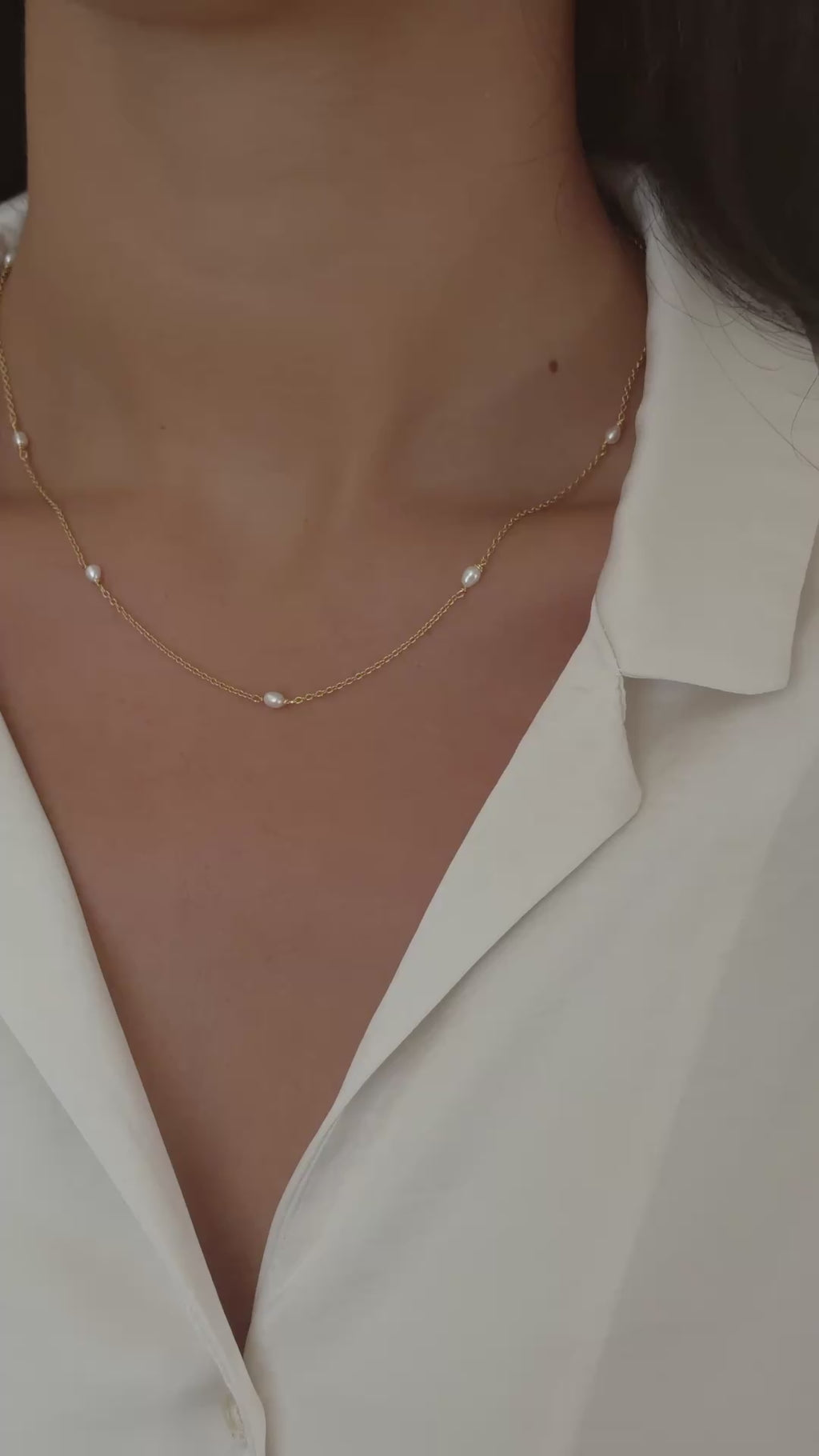 dainty beaded pearl necklace in gold on model video