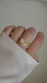 Video of model wearing gold cz oval diamond statement ring set. 