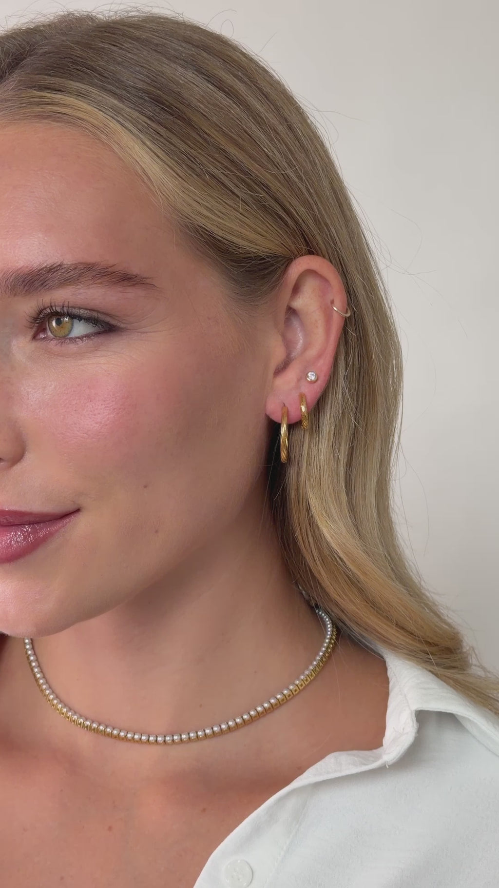 twisted hoop earrings in gold stainless steel styled on model video