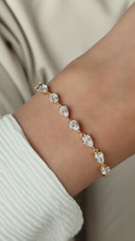 model wearing pear cut diamond tennis bracelet