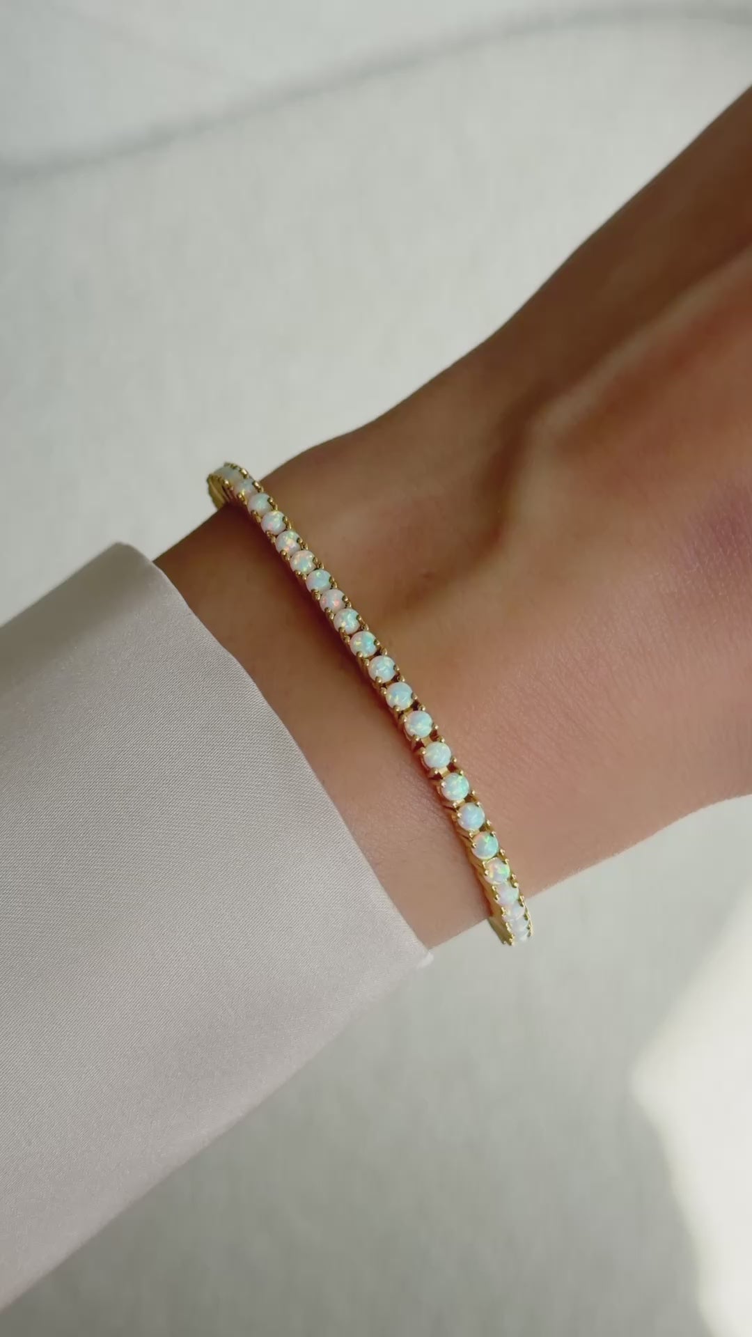 opal tennis bracelet in gold on model video 