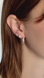 chunky pave diamond hoop earring stacked in gold on models ear video