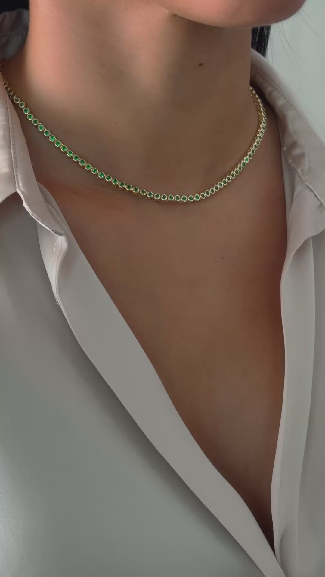 Video of round emerald tennis necklace
