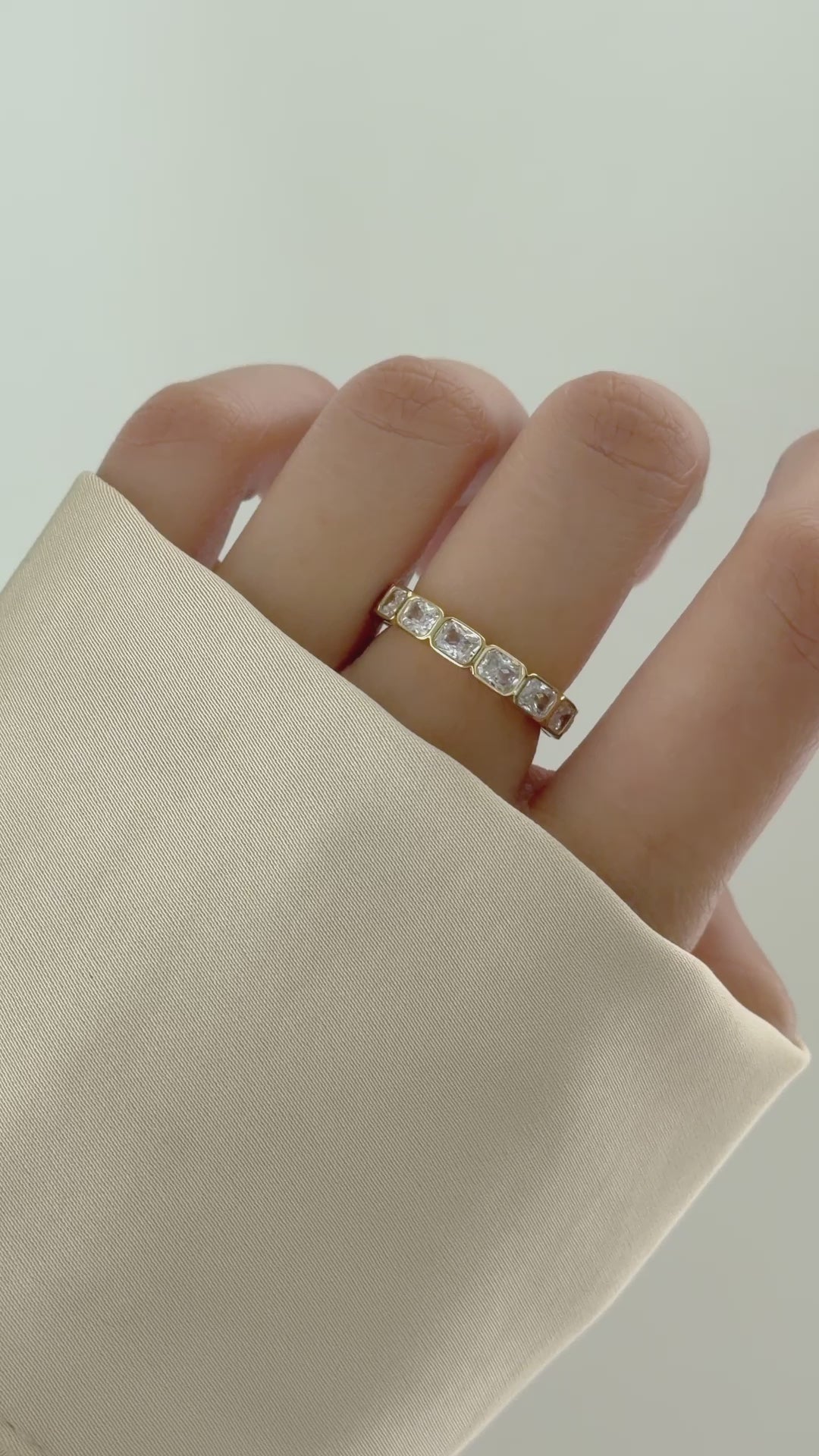 Bezel Emerald Cut Eternity Band in Gold on Model Video - Sami Jewels