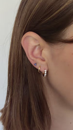 sapphire three stone earrings in gold in models third hole piercing in model video 