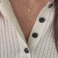 Video of model wearing simple plain gold cross necklaces from Sami Jewels