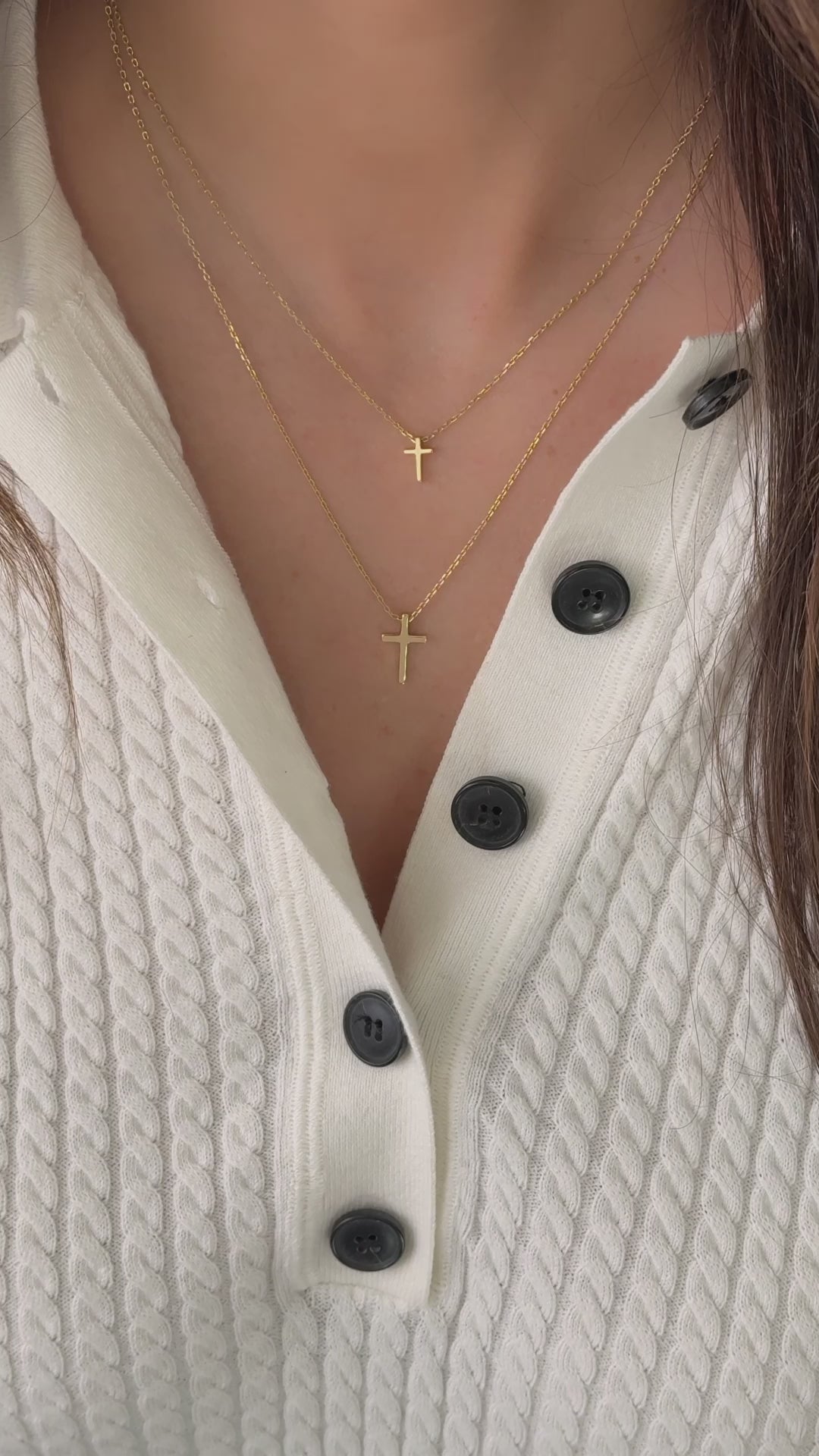 Video of model wearing simple plain gold cross necklaces from Sami Jewels