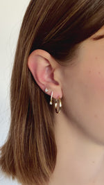 flat hoop earrings in 18mm in gold on model video