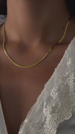 herringbone chain necklace in gold in a 16inch chain length an 18 inch chain length on model 