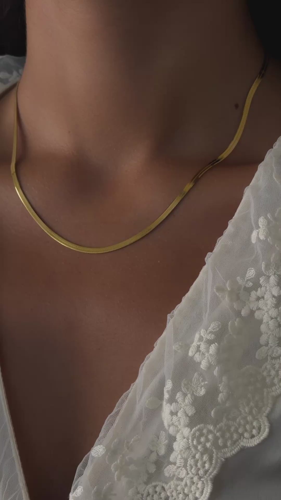 herringbone chain necklace in gold in a 16inch chain length an 18 inch chain length on model 